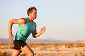 foto of fitness  - Running man sprinting cross country trail run - JPG 