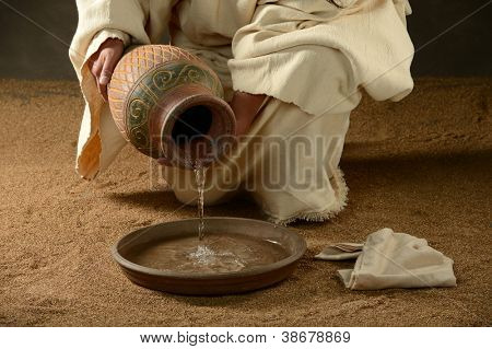 Picture or Photo of Jesus with a jug of water and a towel on a neutral background