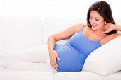 pic of home  - Pregnant woman relaxing at home looking very happy - JPG 