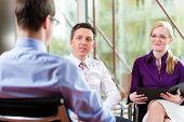 stock photo of meeting  - Man having an interview with manager and partner employment job candidate hiring resume CEO work business - JPG 