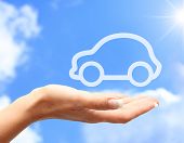 foto of blue  - Hand with car against blue sky background - JPG 