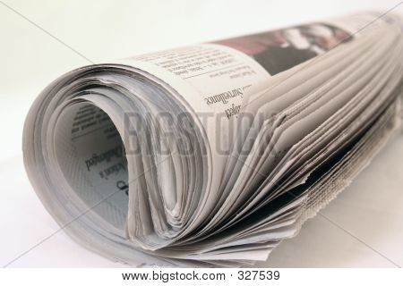 Picture or Photo of A rolled up newspaper