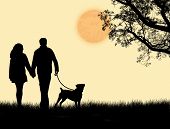 stock photo of sunset  - Silhouette of a couple walking their dog on sunset vector illustration - JPG 