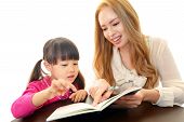 stock photo of english  - Little girl studying in English with teacher
 - JPG 