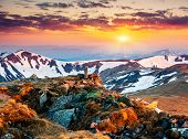 stock photo of sunset  - Majestic sunset in the mountains landscape - JPG 