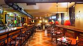 picture of interior  - Interior of a modern pub in orange and wooden colors - JPG 