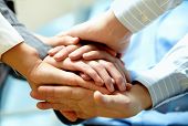 stock photo of handshake  - Image of business people hands on top of each other - JPG 