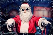 foto of headphones  - Santa Claus is listening to music in headphones - JPG 
