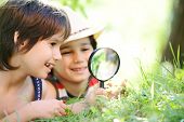 picture of nature  - Happy kid exploring nature with magnifying glass - JPG 