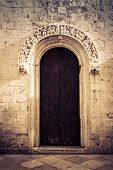 stock photo of portal  - a beautiful wooden portal of a church in south italy - JPG 