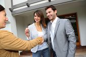 pic of property  - New property owners shaking hands to sales agent - JPG 