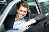stock photo of man  - Handsome man in his new car - JPG 