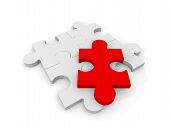 image of puzzle  - 4 Puzzle pieces with a red piece on top - JPG 