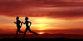 stock photo of health  - Woman and men running during sunset - JPG 
