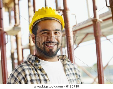 Picture or Photo of Portrait of latin american construction worker looking at camera