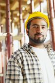 foto of construction  - Portrait of latin american construction worker looking at camera - JPG 
