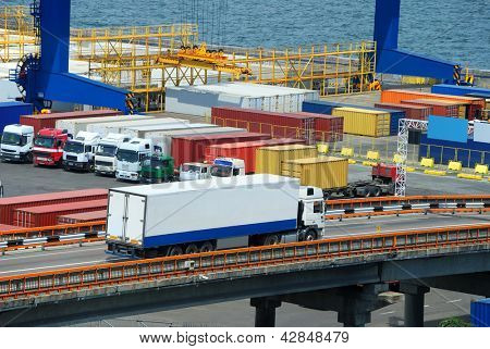 Picture or Photo of White truck transport container in port