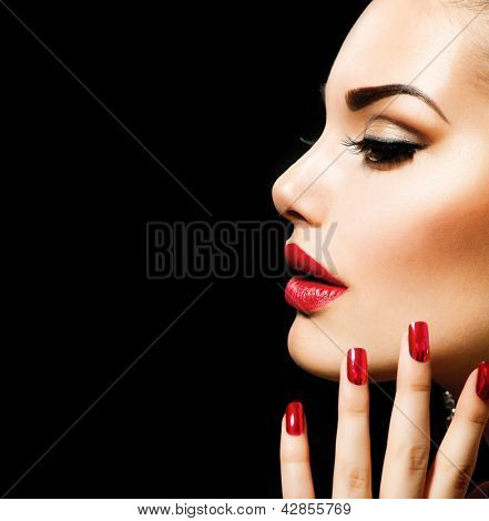 Picture or Photo of Beauty Woman with Perfect Makeup. Beautiful Professional Holiday Make-up. Red Lips and Nails. Beauty Girl