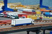 picture of transportation  - white truck transport container in port - JPG 