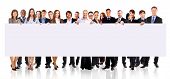 picture of meeting  - group of business people holding a banner ad isolated on white - JPG 