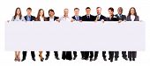 pic of meeting  - group of business people holding a banner ad isolated on white - JPG 