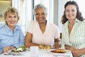 stock photo of restaurant  - Friends Having Lunch Together At A Restaurant - JPG 