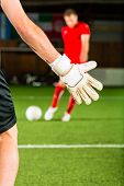 foto of indoors  - Man scoring a goal at indoor football or indoor soccer - JPG 
