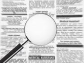 pic of newspaper  - Blank magnifying glass over newspaper - JPG 