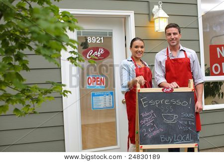 Picture or Photo of Cafe owners in front of shop