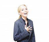 stock photo of laughter  - Beautiful Young Business Woman Has A Lighthearted Giggle Of Laughter While Holding Hand To Chest In A Funny Business Concept Isolated On White Background
 - JPG 