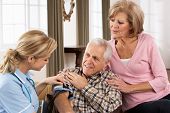 stock photo of pressure  - Health Visitor Taking Senior Man - JPG 