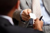 picture of business concept  - Closeup portrait of two successful business executive exchanging business card - JPG 