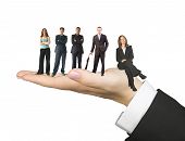 picture of business people  - hand of a woman over white facing up with business people on it - JPG 