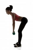 stock photo of fitness  - sport young woman athlete doing hands and legs bending exercise with dumbbells - JPG 