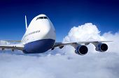 stock photo of transportation  - Airplane at fly on the sky with clouds - JPG 