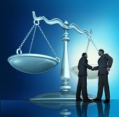 picture of merger  - Contract agreement with a group of two businessmen shaking hands in a legal partnership with a scale of justice in the background as a concept of teamwork in business - JPG 