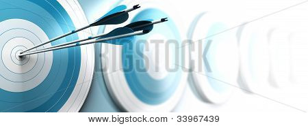 Picture or Photo of Many blue targets and three arrows reaching the center of the first one image fading from blue to white with blur effect horizontal format dedicated for a banner. Strategic marketing or business competitive advantage concept.