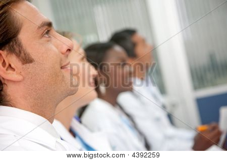 Picture or Photo of Doctors in a hospital having a meeting
