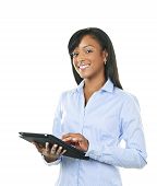 stock photo of business people  - Young smiling black woman using tablet computer - JPG 
