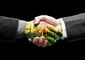 stock photo of conglomerate  - hand shake with technology - JPG 