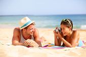 image of  photo  - Beach fun couple travel - JPG 