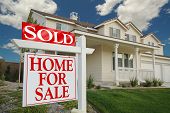 image of home  - Sold Home For Sale Sign in front of Beautiful New Home - JPG 