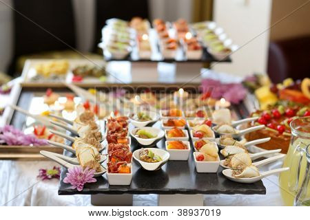 Picture or Photo of Luxury food and drinks on wedding table. Shallow DOF