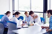 stock photo of meeting  - Group of happy young  business people in a meeting at office - JPG 